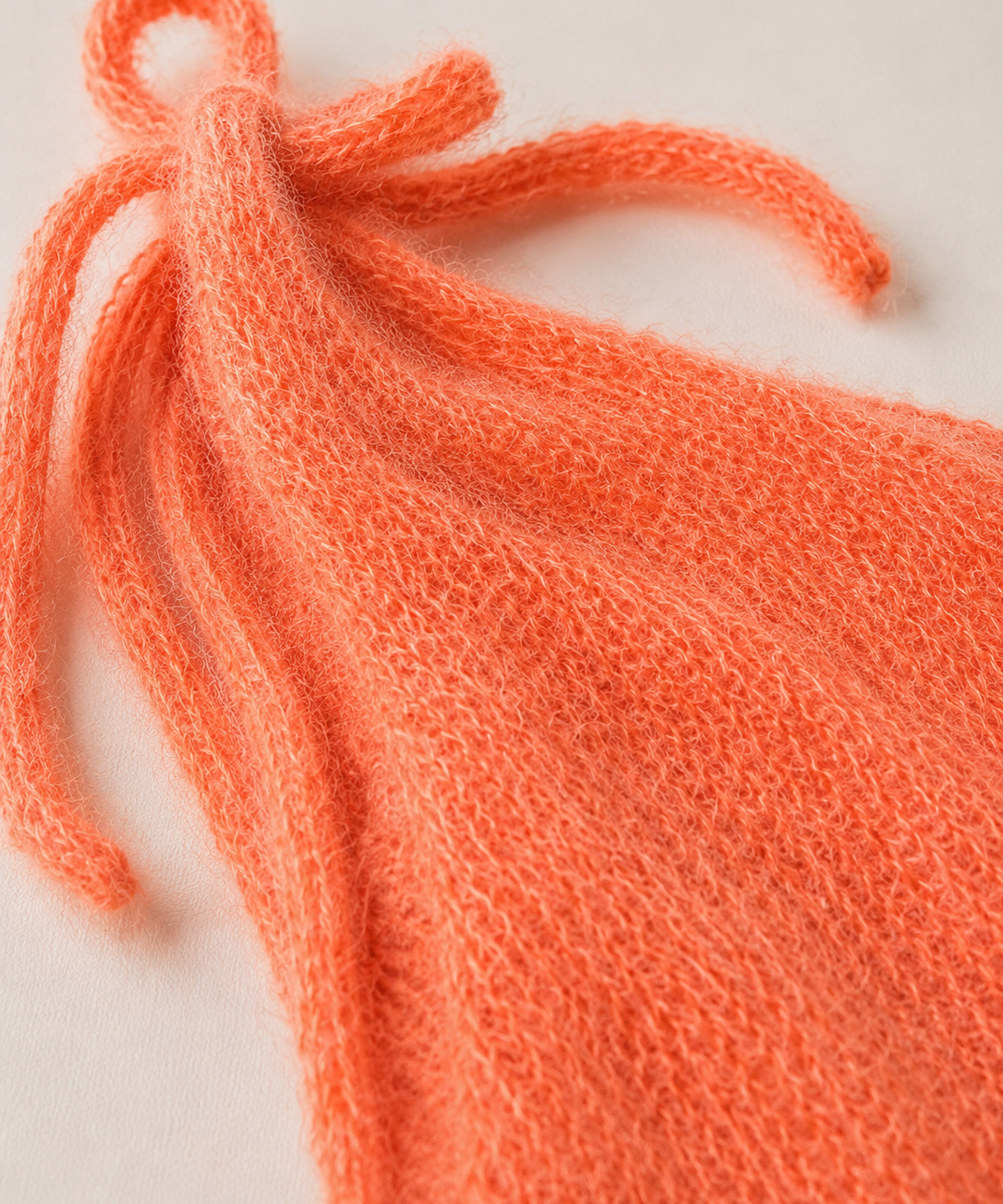 Stricktop mit Schleifen sunset coral